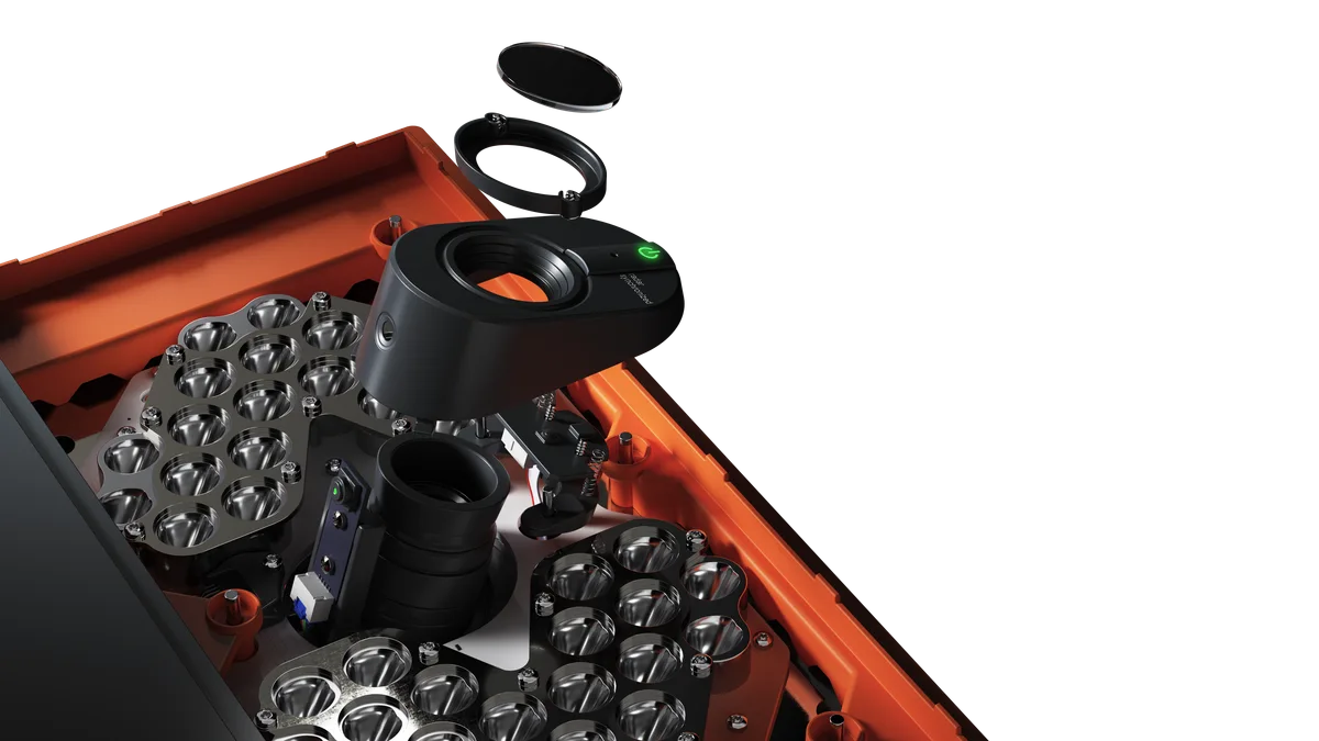 Exploded product render showing the imaging and sensing components inside a Trackman iO